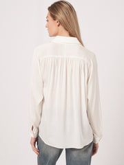 Long sleeve button front blouse with gathered yoke details