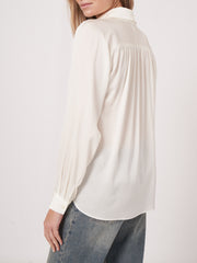 Long sleeve button front blouse with gathered yoke details